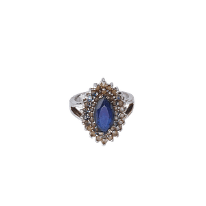 Bague en métal argenté sertie d’une pierre de zircon bleu