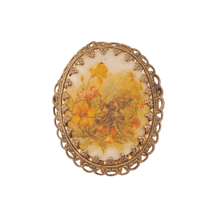 Broche ovale en pierre florale et métal doré